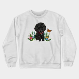 Black Fluffy Poodle Sitting on Grass with Flowers Crewneck Sweatshirt